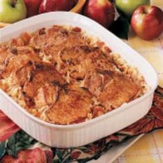 a casserole dish with apples in the background