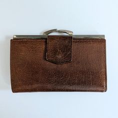 A vintage 1960s ladies leather purse in brown Montana Calf leather.   The purse has a clasp to close and the inside section of the purse has two compartments for coins There is a side wallet which opens out to hold notes and there is a section for a pass/driving licence etc. Additionally there is a zipped compartment  The purse measures 14cm x 9.5cm when closed Very good condition and clean inside Vintage Brown Wallet For Travel, Vintage Brown Rectangular Wallet, Vintage Brown Travel Wallet, Vintage Travel Wallets With Coin Pocket, Vintage Brown Wallets With Card Slots, Vintage Travel Wallet With Coin Pocket, Retro Brown Wallet For Everyday Use, Vintage Rectangular Wallets For Formal Occasions, Vintage Bifold Coin Purse For Travel