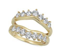 two yellow gold rings with white diamonds on each one and an open band in the middle