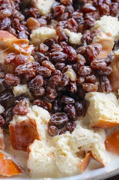 a plate with raisins and bread on it