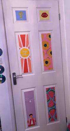 the door is decorated with pictures and magnets