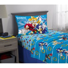 a bed with sonic the hedgehog comforter and sheets