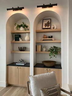 a living room filled with furniture and shelves