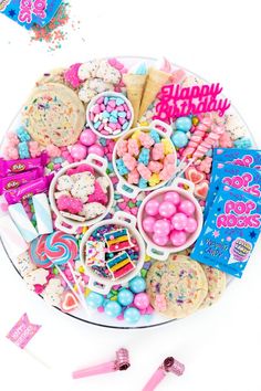 a birthday platter filled with cookies, candy and candies