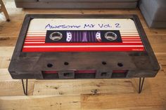 a coffee table made out of an old cassette player with the words awesome mix vol 2 written on it