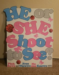 a sign that says, he or she shoot to see? with basketballs on it