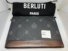 This Berluti Nino GM clutch is composed of Berluti's black signature canvas and brown leather. It features one zipped compartment with card slots. Model: M207348 Color: Brown & Black Material: Canvas & Leather Made in: Italy Size: 32 x 21 x 2 cm Condition: NEW with dust bag. Warehouse Storage, Inside The Box, Signature Canvas, Canvas Leather, Leather Clutch, Shoe Box, Storage Boxes, Card Slots, Slots