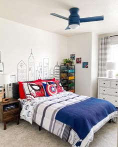 a bed room with a neatly made bed next to a window and a ceiling fan