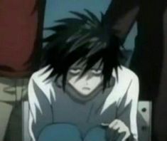 an anime character with black hair sitting down