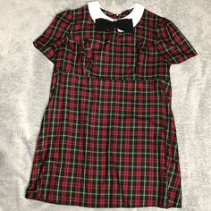 Women’s Plus Size Fitted Plaid Dress Bow & Collar Zip Up With Button Neck Closure Short Sleeve Never Worn Has A Hole In The Seem At The Hip. Can Be Repaired Ireland Size 20 Us Size 16 Pit To Pit- 22” Waist-20 1/2” Length-34” D-2 Retro Short Sleeve School Dresses, Casual Knee-length Holiday Dresses, Casual Short Sleeve Plaid Dress With Buttons, Casual Collared Plaid Dress, Casual Plaid Short Sleeve Dress With Buttons, Casual Plaid Dress With Short Sleeves And Buttons, Preppy Plaid Short Sleeve Dress, Plaid Mini Dresses With Button Closure, Plaid Mini Dress With Button Closure