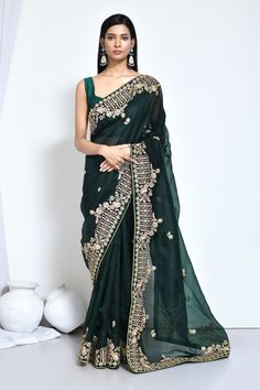 Green organza silk embroidered saree with blouse N8122C Get your hands on the newest collection of exquisite organza silk sarees adorned with intricate embroidery and stunning stone embellishments, all at budget-friendly prices. These sarees feature soft pastel tones and elegant floral designs, ensuring they remain stylish and timeless for years to come. Purchase these luxurious satin silk sarees exclusively at Kollybollyethnics. Desc:  Color : Green Fabric : organza silk Blouse Work : embroidery  Wash Care : Dry clean Sleeve Style : Half Sleeve Long Sleeves : Done only in Custom Stitch Sleeves Lining : Done only in Custom Stitch Bust Size : 32 to 42 Inches Occasion : Festival   Christmas   Eid   Ceremonial   Pongal   Lohri   Gudi Padwa   Onam   Ugadi   VaisakhiFancy saree organza sil Saree Organza, Lehenga Style Saree, South Silk Sarees, Wedding Saree Collection, Organza Silk Saree, Salwar Dress, Dress Salwar Kameez, Lehenga Style, Saree Designs Party Wear