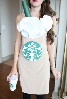 a woman in a starbucks costume holding a cup