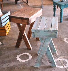 two wooden benches sitting next to each other on top of a cement floor in front of tables and chairs