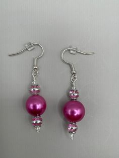 Round pink glass beads with pink and silver accents on silver ear wires Diy Jewelry Unique, Glass Balls, Earrings Round, Pink And Silver, Sarasota Fl, Origami Art, Jewelry Unique, Glass Heart, Delicate Earrings