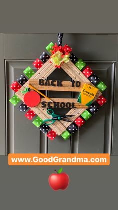 the back to school wreath is hanging on the door