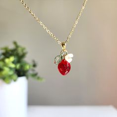 Discover the sweet and delicate beauty of our mini strawberry necklace. Come to make your own strawberry necklace! You choose the design; we hand make the necklace for you. The mini strawberry fruit necklace is handcrafted with love and attention to detail, this dainty piece is perfect for adding a touch of whimsy to any outfit. 🍓Material: handmade with Czech glass mini strawberries, acrylic flowers, acrylic leaves, and 14K gold plated/925 sterling silver plated (hypoallergenic) necklace chain. Fruit Necklace Jewelry, Cute Fruit Design Dangle Jewelry, Peach Necklace Fruit, Fruit Charm Necklace, Cute Strawberry Necklace, Hypoallergenic Necklace, Strawberry Necklace, Food Necklace, Fruit Necklace