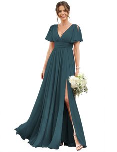 a woman in a long green dress with a slit down the side and a flower bouquet