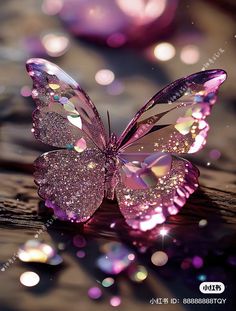 a pink butterfly sitting on top of a wooden table covered in water droplets and sparkles