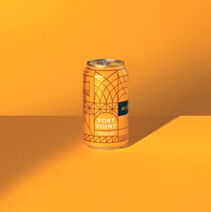 a can of fort point beer on a yellow background