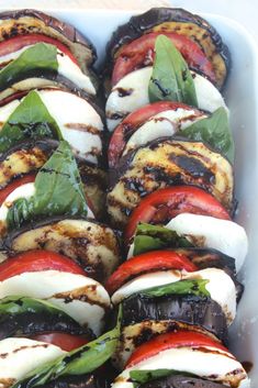 several grilled vegetables in a white dish