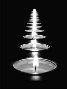 candles are lit in the middle of a black and white photo with words good night sweet dreams