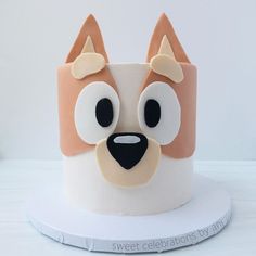 a cake decorated to look like a dog's face