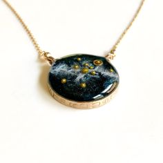 "A beautiful, handmade reminder of our place in the universe and connection to each other.  This Solar System Necklace has golden glass microbeads carefully hand placed to create our sun and planets on a backdrop of the shimmering milky way galaxy made of mica. The scene floats in a sparkling inky resin and is covered with a clear dome, adding dimensions and depth to this celestial scene.  Stamped with the word STARDUST, the bezel is hand cast from your choice of sterling silver or bronze and ha Sun And Planets, Necklace Planet, Virgo Jewelry, Solar System Necklace, Virgo Necklace, Galaxy Necklace, Planet Necklace, Astrology Necklace, Zodiac Sign Necklace