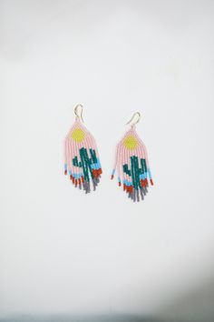 These boho beaded earrings are handcrafted from high quality Czech beads and metal components. You will be noticed everywhere with its unique colors and models. Earrings that you can use comfortably will add color to your style. These inspiring bead earrings are made of high quality Czech beads and metal components. **Avoid contact with creams and similar products. ♡Length - 2.75'' (7 Centimeters ) ♡Width - 1.18'' (3 Centimeters) ♡Stainless hooks ♥ Back to my shop:  https://www.etsy.com/shop/BejBeadedStore Unique Teardrop Earrings With Tiny Beads, Artsy Adjustable Beaded Earrings With Colorful Beads, Festival Teardrop Earrings With Tiny Beads, Artisan Beaded Drop Earrings For Festival, Artsy Adjustable Colorful Beaded Earrings, Artsy Dangle Beaded Earrings With Ear Wire, Artsy Beaded Drop Earrings With Ear Wire, Unique Beaded Earrings With Tiny Beads For Festivals, Artisan Beaded Drop Earrings