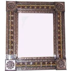 a decorative mirror with an ornate design on it