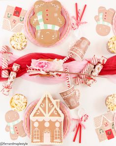 a table topped with lots of different types of candy and candies on top of paper plates