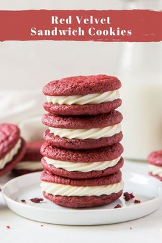 red velvet sandwich cookies stacked on top of each other with white frosting in the middle