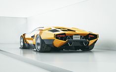 a yellow and black sports car parked in a white room