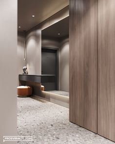 a modern bathroom with marble flooring and wooden doors