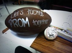 a football sitting on top of a wooden table