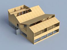 a wooden model of a building with windows and balconies on the top floor