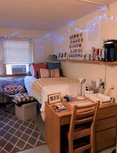 a dorm room with two beds and desks