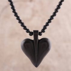 Hand-carved from ebony wood, the heart-shaped pendant of this necklace makes for a fashionable and romantic accessory. India's Sapna Mehta designs this accessory, circling the neck with petite ebony wood beads. A sterling silver extender chain increases the necklace's length. Spiritual Black Heart-shaped Necklace, Ebony Jewelry With Wooden Beads For Gifts, Ebony Jewelry With Wooden Beads As A Gift, Spiritual Black Heart-shaped Necklaces, Beaded Pendant Necklace, Necklace Heart, Ebony Wood, Jewelry Packaging, Beaded Pendant