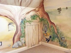 a child's room painted with trees and animals