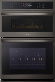 two double ovens side by side with the same door open and light on in front