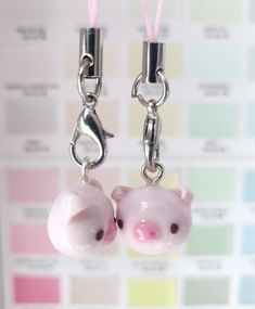 two little pigs are attached to the same key chain