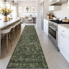 a long rug in the middle of a kitchen