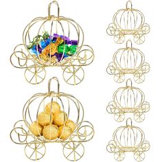 two gold metal baskets filled with candies and chocolates, one in the shape of a birdcage