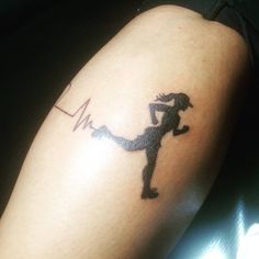 a person with a tattoo on their arm and the image of a woman holding a tennis racquet