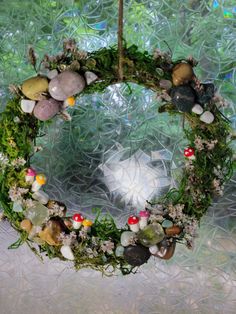 a wreath made out of rocks and moss