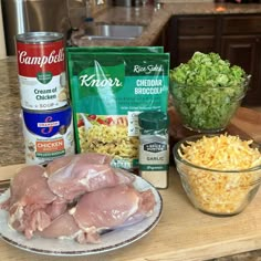 ingredients to make chicken broccoli salad on a countertop with bowls and cans