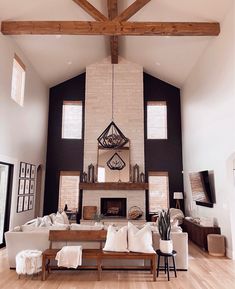 a living room filled with furniture and a fire place in the middle of a room