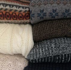 a pile of sweaters sitting on top of each other