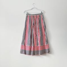 80s red, white, and blue pinstriped pleated midi skirt from brand Breckenridge. One side has a pocket and the other is hook and eye closure. Vertical stripes meet horizontal stripes at the hem.  Lightweight fabric of 70% cotton, 30% linen.  Vintage size 8 - fits like medium 13 inches across the waist,  31.5 inches full length Check out other listings in our shop for more vintage clothing, housewares, and more: Uprightvintagemi.etsy.com *Please read the item description and title, view all photos Vintage Lined Pleated Skirt For Summer, Retro Summer Pleated Skirt, Retro Full Pleated Skirt For Summer, Striped Pleated Skirt Bottoms For Summer, Striped Pleated Skirt For Summer, Retro Pleated Flared Skirt For Summer, Retro Summer Pleated Midi Skirt, Retro Summer Midi Pleated Skirt, Spring Striped Flared Skirt