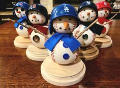 snowmen with hats and baseballs on their heads