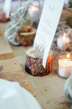 an image of a table setting with candles and place cards